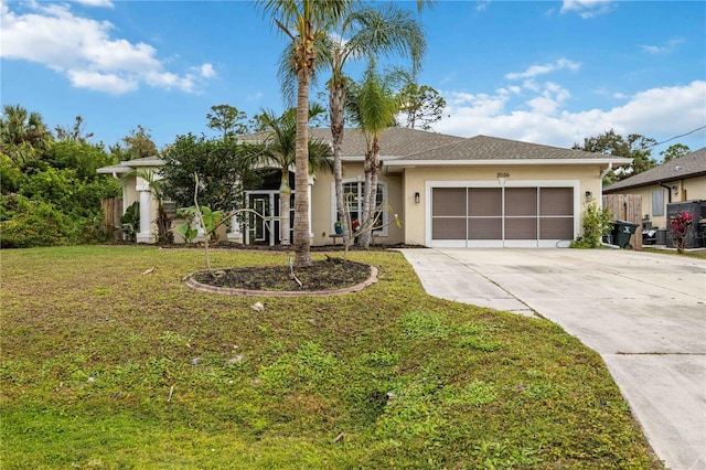 ranch-style house featuring a front yard and a garage