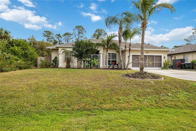 view of front facade with a front yard and a garage