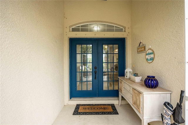 entrance to property featuring french doors