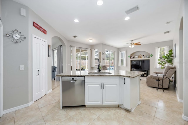 kitchen featuring white cabinetry, dishwasher, a center island, and sink