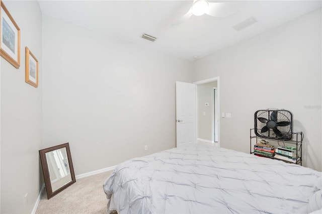 bedroom featuring light colored carpet and ceiling fan