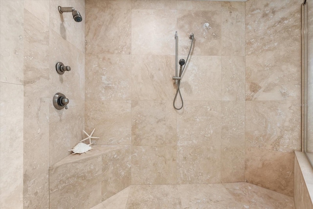 bathroom with tiled shower