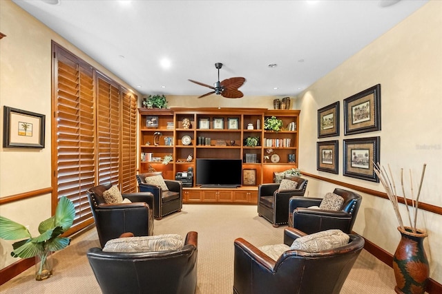 living room with light carpet and ceiling fan