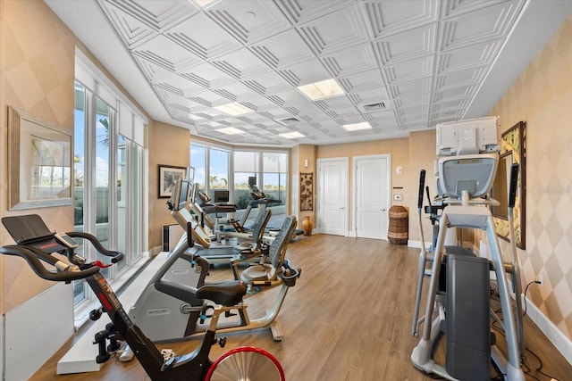 gym featuring light hardwood / wood-style floors