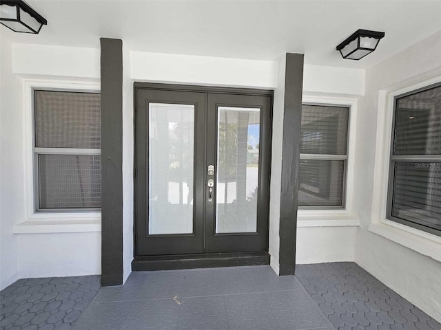 entrance to property featuring french doors