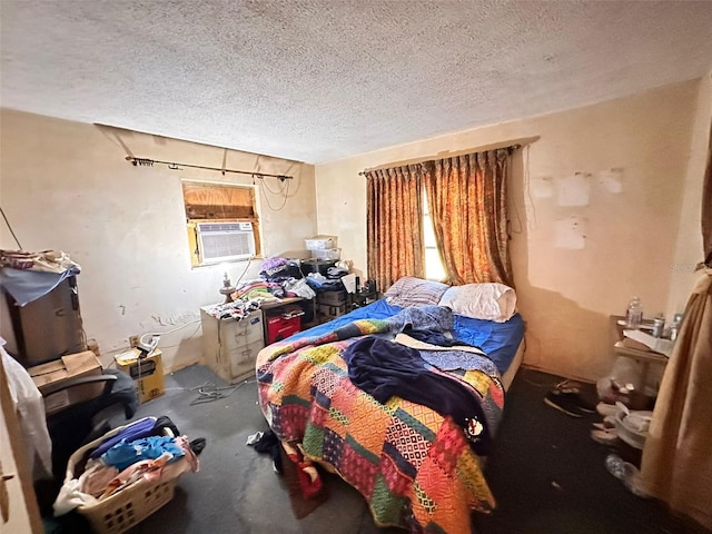 bedroom featuring cooling unit and a textured ceiling