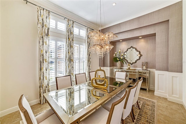 dining area with an inviting chandelier and crown molding