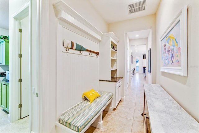 corridor with light tile patterned floors