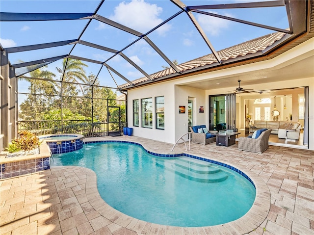 view of pool featuring ceiling fan, a lanai, an outdoor hangout area, a pool with connected hot tub, and a patio area