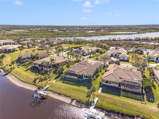 birds eye view of property featuring a water view and a residential view