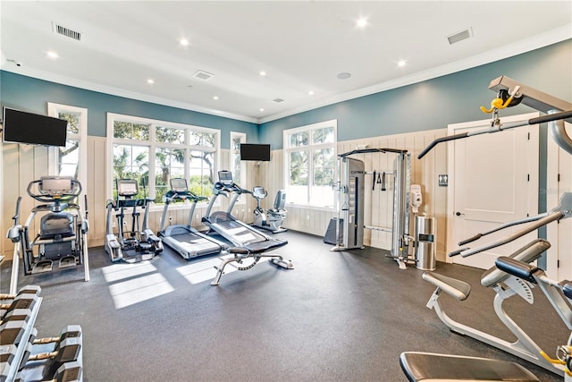 workout area with ornamental molding, visible vents, and recessed lighting