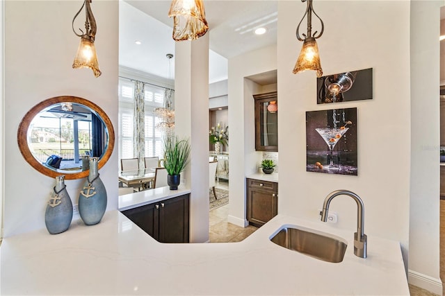 bar featuring pendant lighting, a sink, and recessed lighting