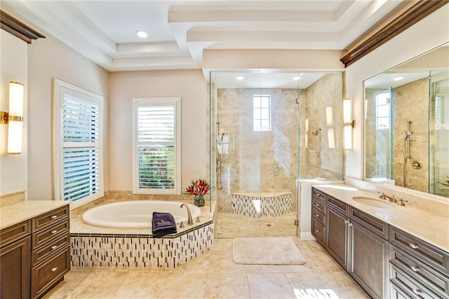 bathroom featuring a shower stall, a bath, and vanity