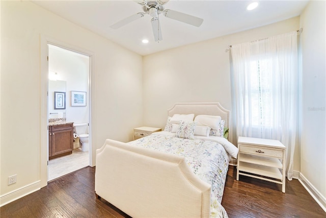 bedroom featuring ensuite bathroom, ceiling fan, recessed lighting, dark wood-type flooring, and baseboards