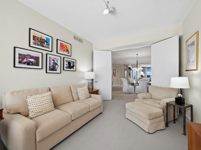 carpeted living room with visible vents