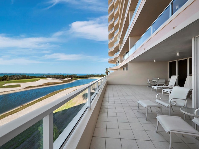 balcony featuring a water view