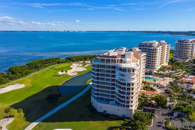 birds eye view of property featuring a water view and view of golf course