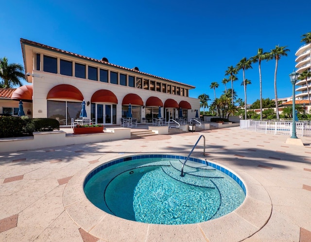 view of pool featuring a patio area, fence, and a swimming pool