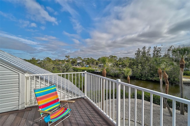 wooden deck featuring a water view