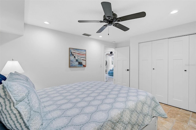 bedroom with ceiling fan and a closet