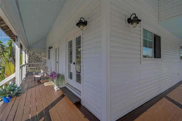 wooden terrace featuring covered porch