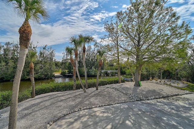 view of community with a water view