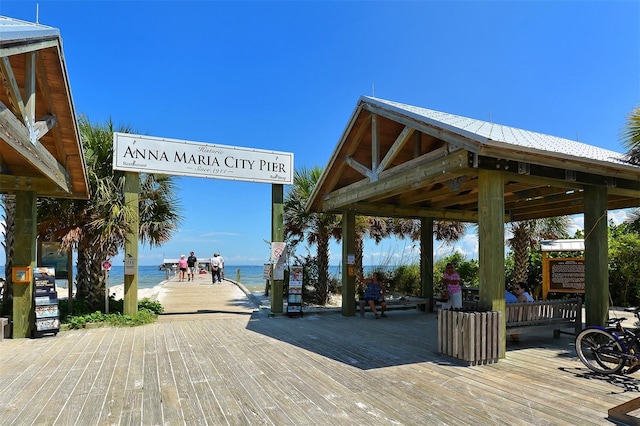 view of property's community with a gazebo and a water view