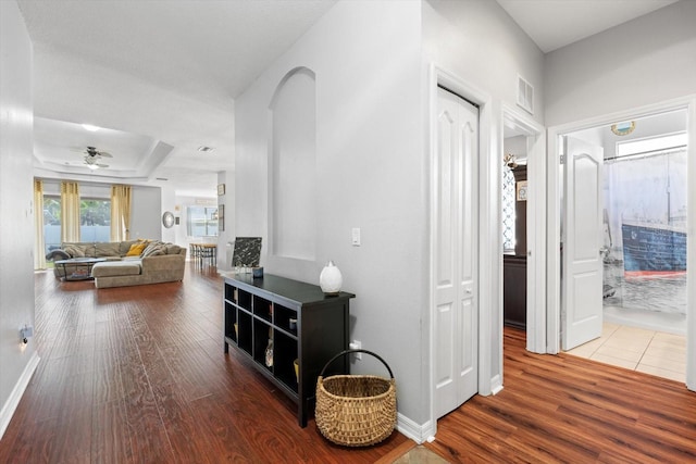 hall with hardwood / wood-style floors