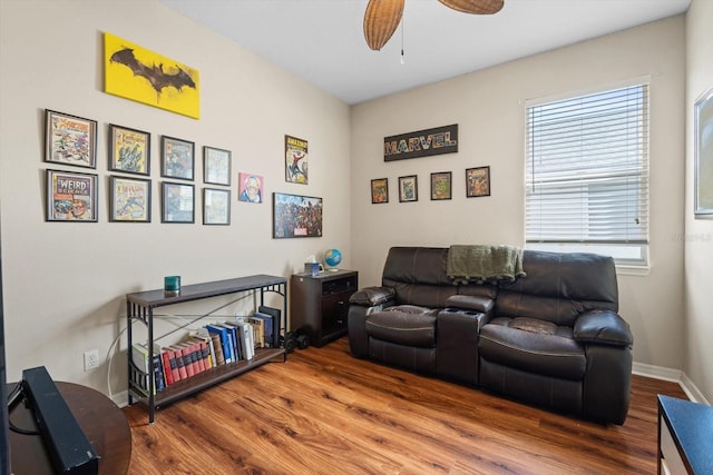 living room with hardwood / wood-style floors and ceiling fan