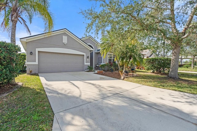 view of front of house featuring a garage and a front lawn