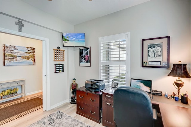 office area with light hardwood / wood-style floors