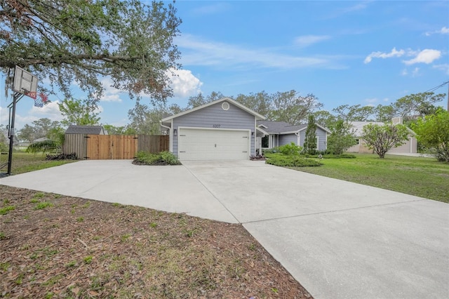 view of front of house featuring a garage and a front yard