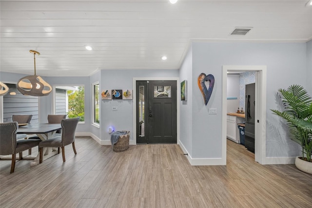 foyer featuring wooden ceiling and light hardwood / wood-style floors