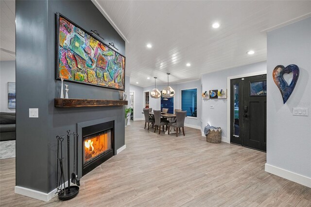 interior space with wood-type flooring, a notable chandelier, and wood ceiling