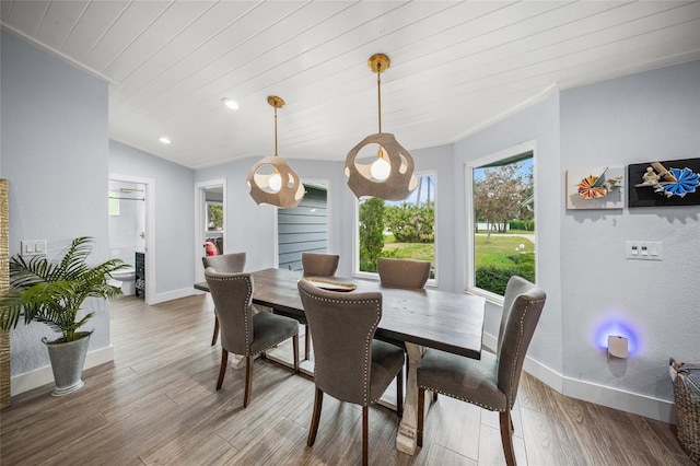 dining space featuring hardwood / wood-style floors and wooden ceiling