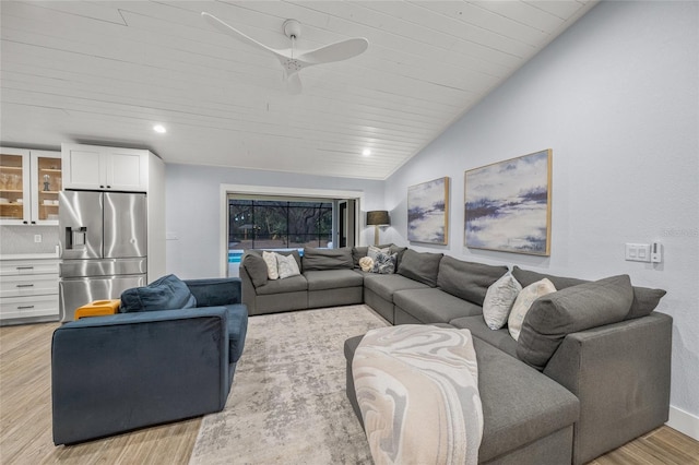 living room featuring light hardwood / wood-style flooring, wooden ceiling, and vaulted ceiling