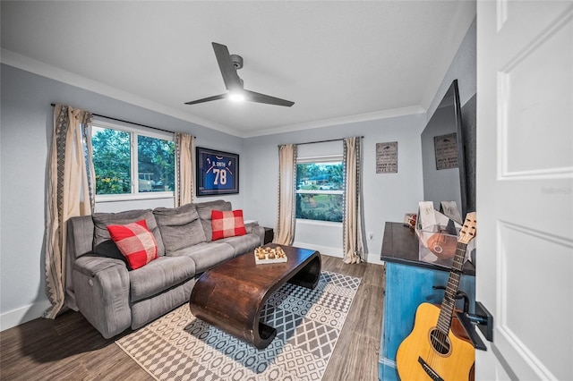 living room featuring ornamental molding, plenty of natural light, and hardwood / wood-style floors