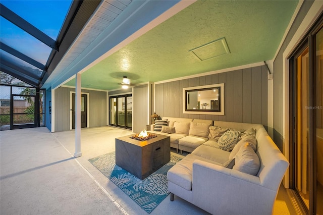 view of patio / terrace featuring an outdoor living space with a fire pit