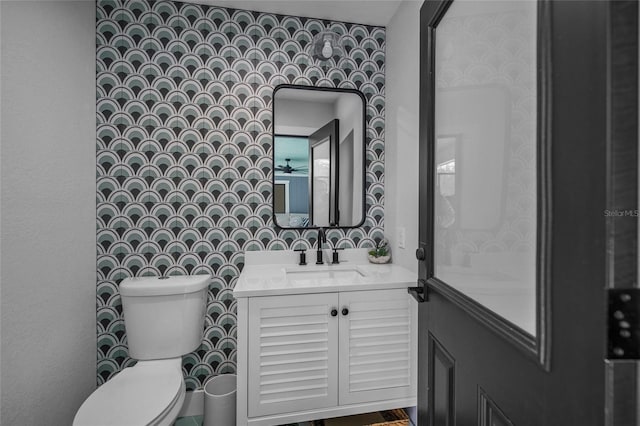 bathroom with vanity and toilet