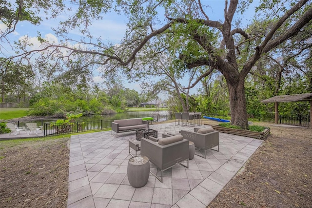 view of patio with a water view and an outdoor hangout area