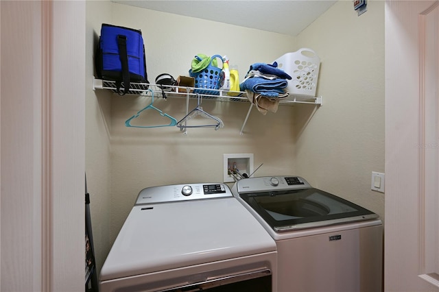 washroom with washer and clothes dryer