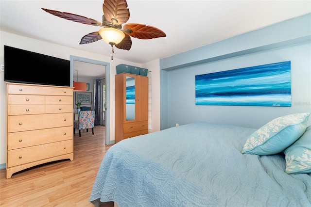 bedroom with ceiling fan and hardwood / wood-style floors