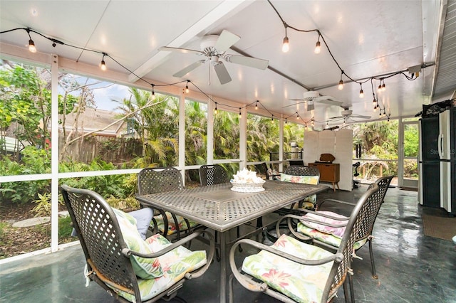 sunroom / solarium with ceiling fan