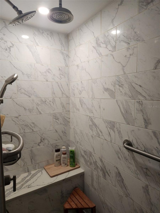 bathroom with a tile shower