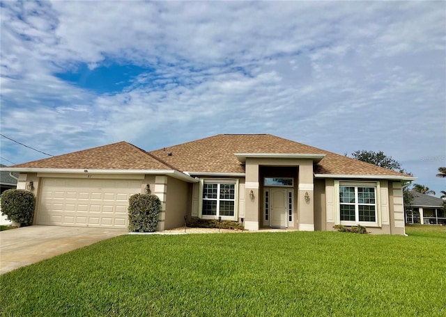 view of front of home featuring a front yard and a garage