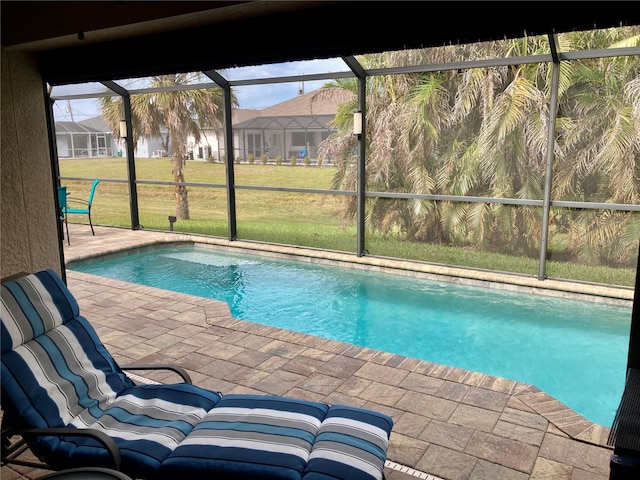 view of swimming pool featuring a yard and a patio