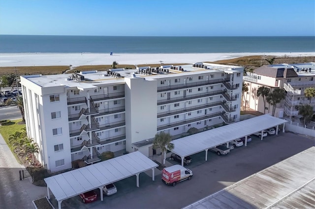 birds eye view of property with a beach view and a water view