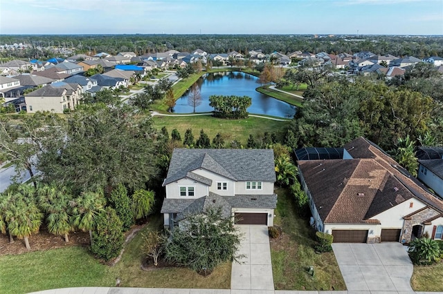 birds eye view of property featuring a water view