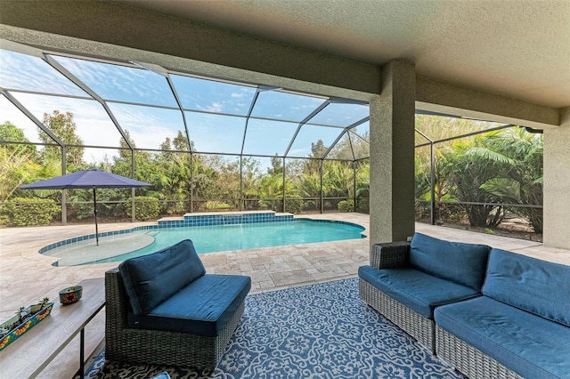 pool featuring a patio area, an outdoor hangout area, and a lanai