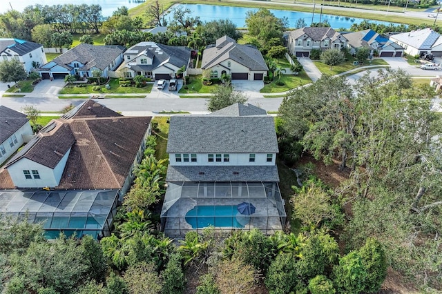 birds eye view of property featuring a residential view and a water view